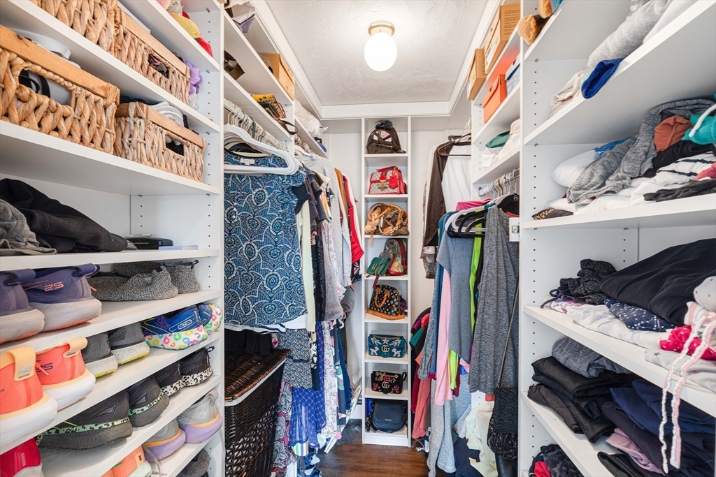 54 Old Merrill Street Amesbury, MA 01913 - Photo 21 of 34 a view of walk in closet with clothes and shoes