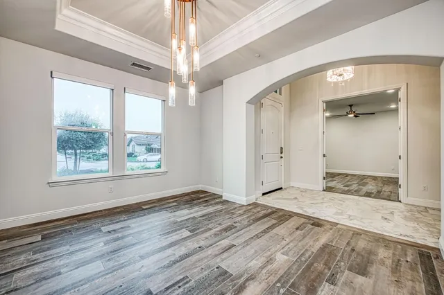 a large bathroom with a granite countertop sink a large mirror and a window