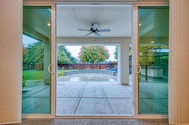 a bathroom with a granite countertop sink a mirror and a shower