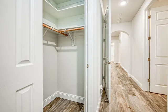 a view of a kitchen with a sink and a window
