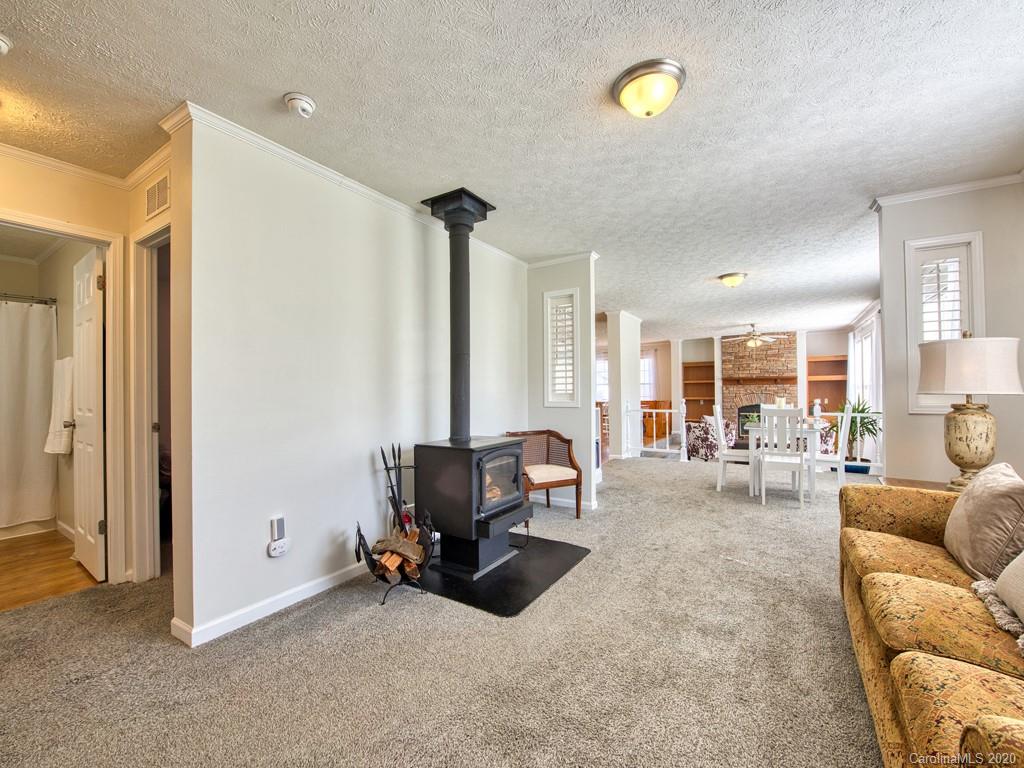 117 Patton Farm Road Canton, NC 28716 - Photo 22 of 30 a living room with furniture and a lamp