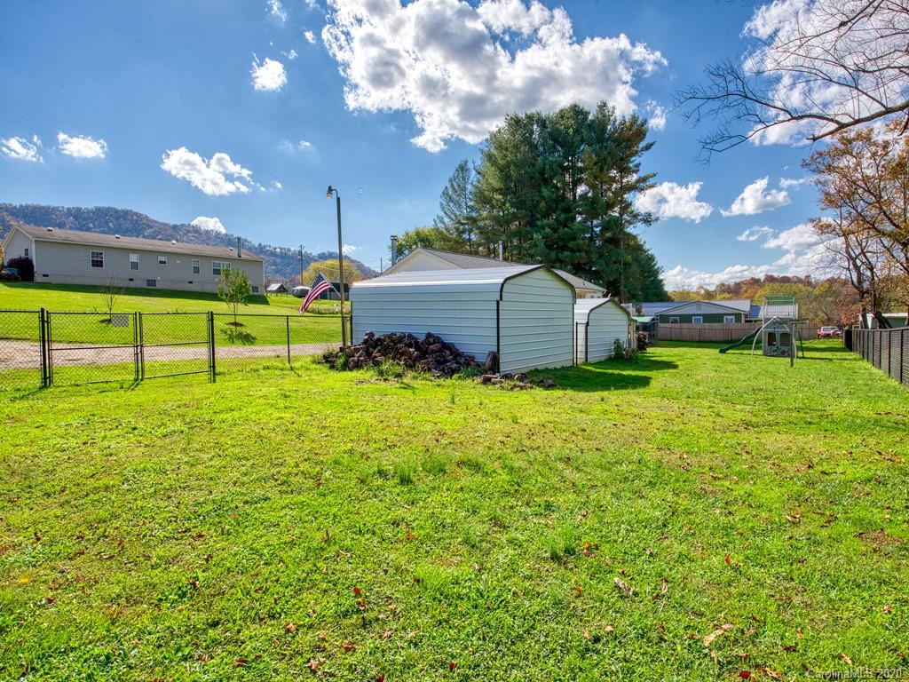 117 Patton Farm Road Canton, NC 28716 - Photo 5 of 30 a view of a house with yard and a garden