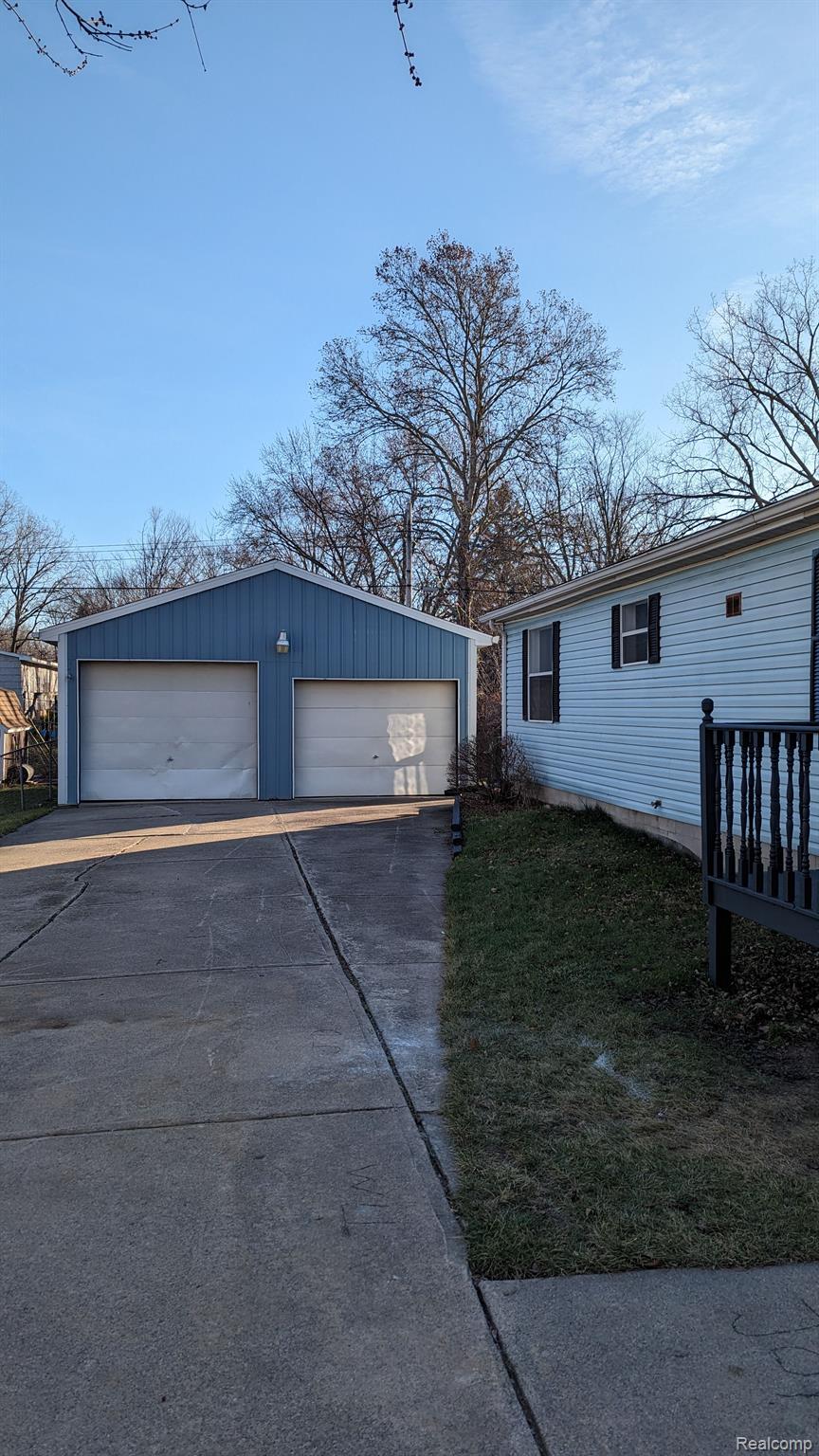 6227 Kenbrook Road Lansing, MI 48911 - Photo 3 of 24 GARAGE WITH 8 FOOT DOOR