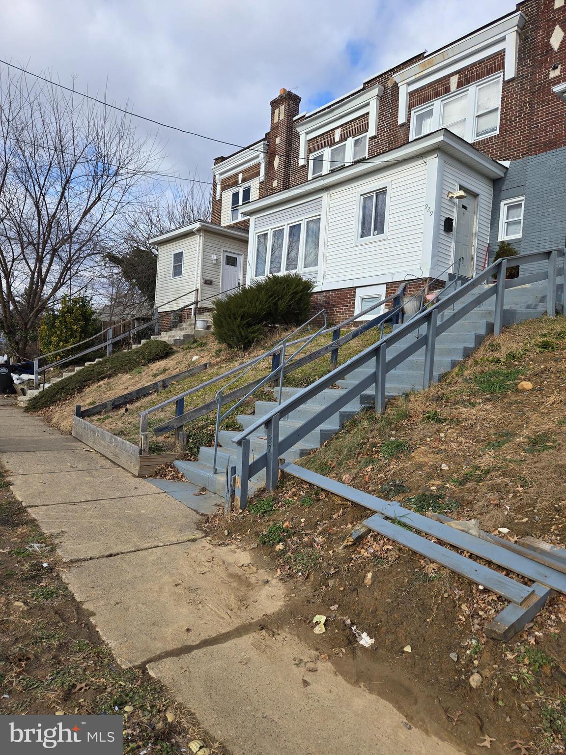 933 Keystone Road Chester, PA 19013 - Photo 1 of 8 a front view of a house with large trees