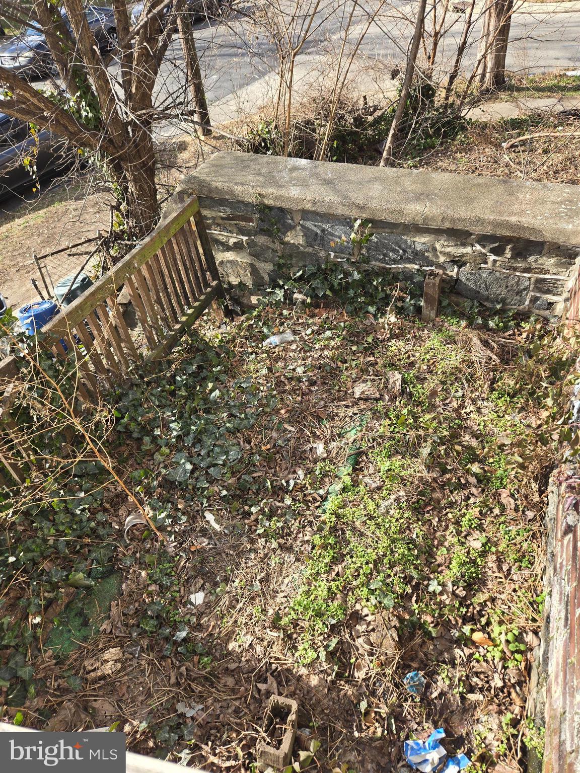 933 Keystone Road Chester, PA 19013 - Photo 2 of 8 a view of a yard with wooden fence