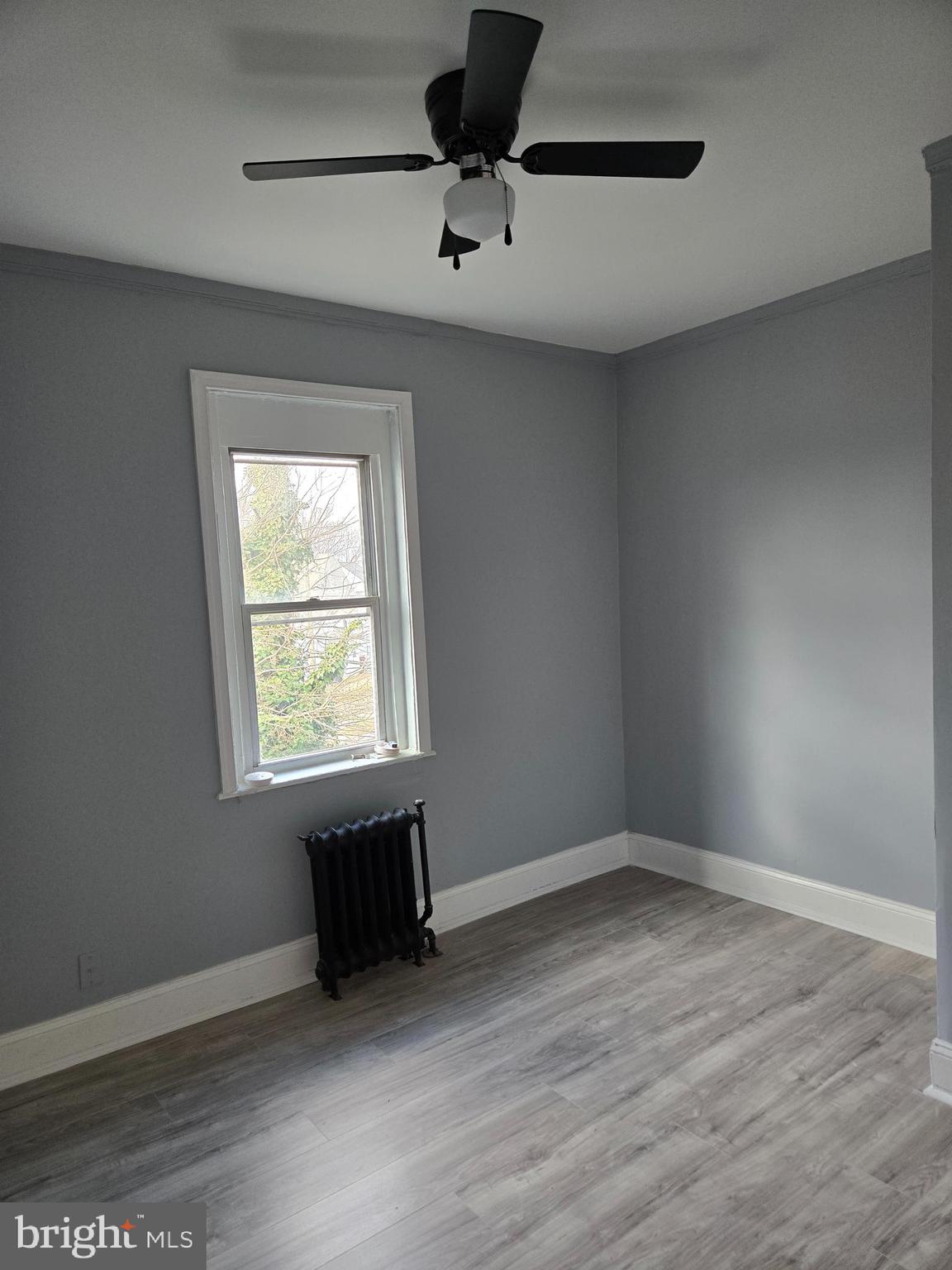 933 Keystone Road Chester, PA 19013 - Photo 7 of 8 an empty room with a window