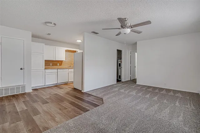 a view of a kitchen with a sink and cabinet area