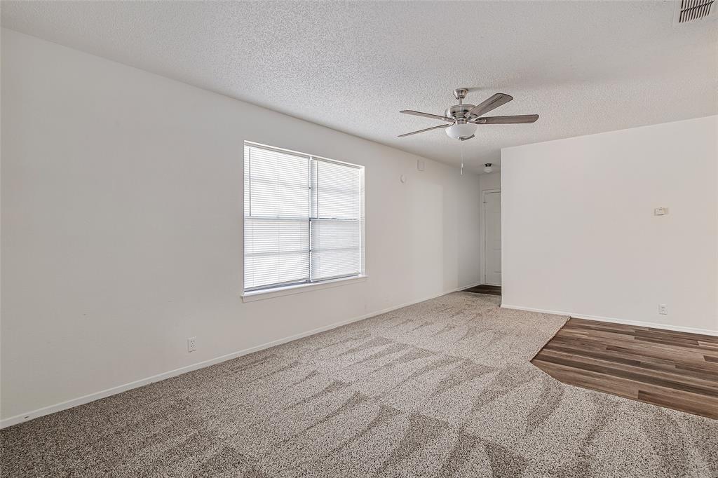1312 Ridge Run Street, Unit A Cleburne, TX 76033 - Photo 4 of 16 an empty room with windows and fan