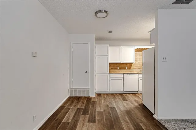 a view of kitchen with wooden floor