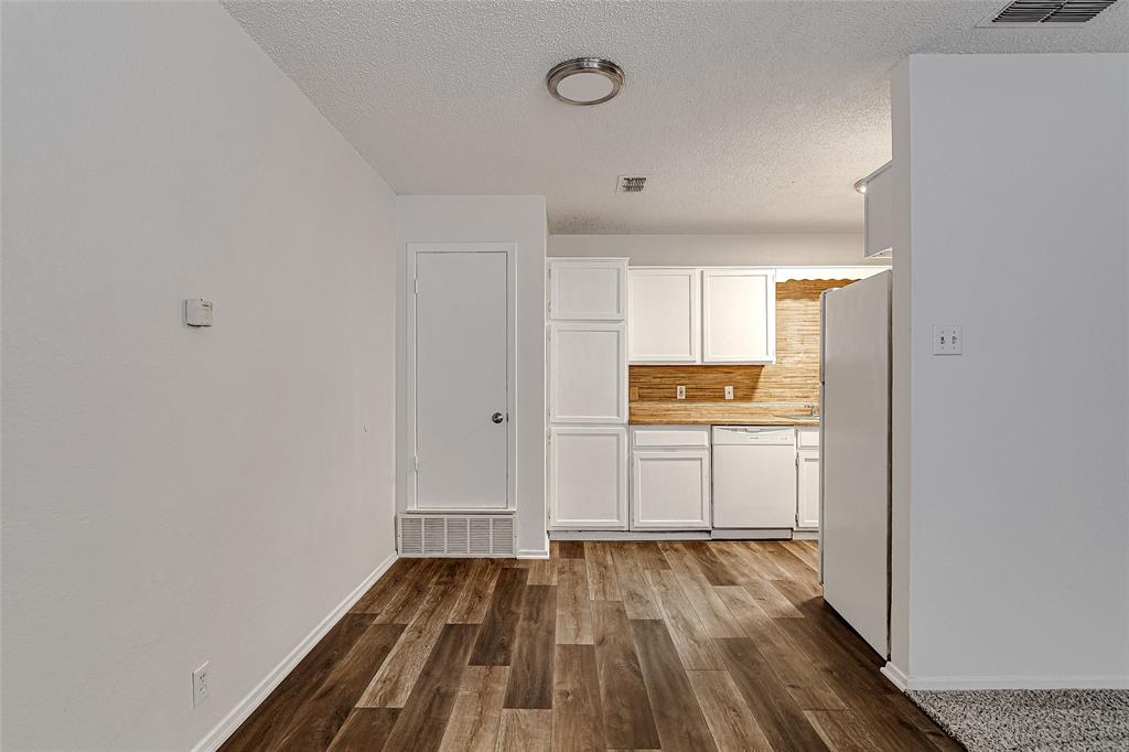 1312 Ridge Run Street, Unit A Cleburne, TX 76033 - Photo 6 of 16 a view of kitchen with wooden floor
