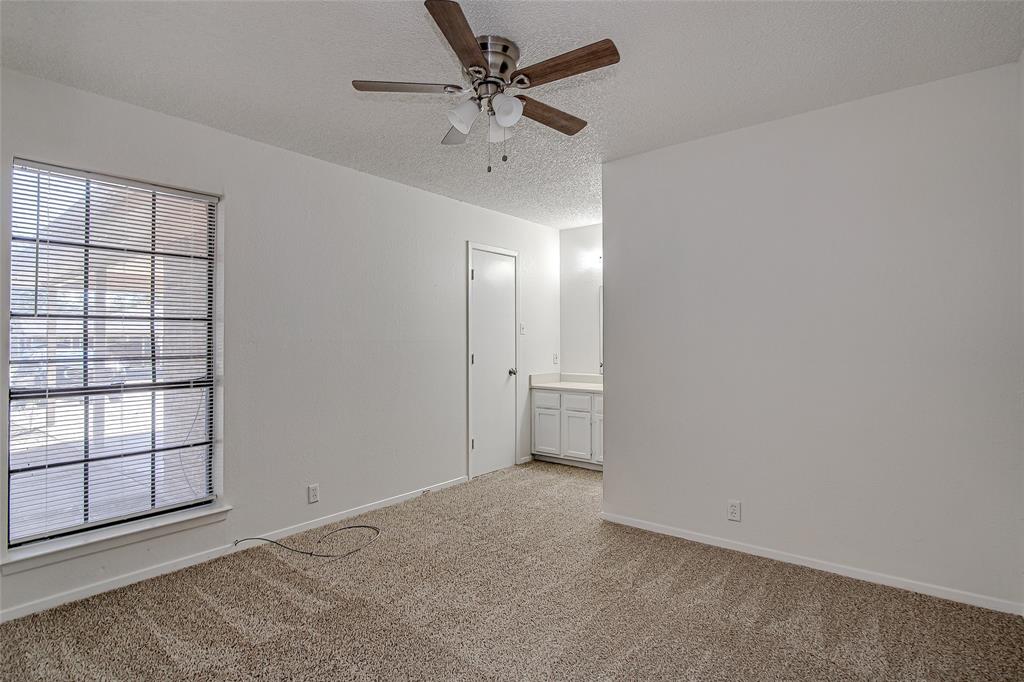1312 Ridge Run Street, Unit A Cleburne, TX 76033 - Photo 9 of 16 an empty room with fan and windows