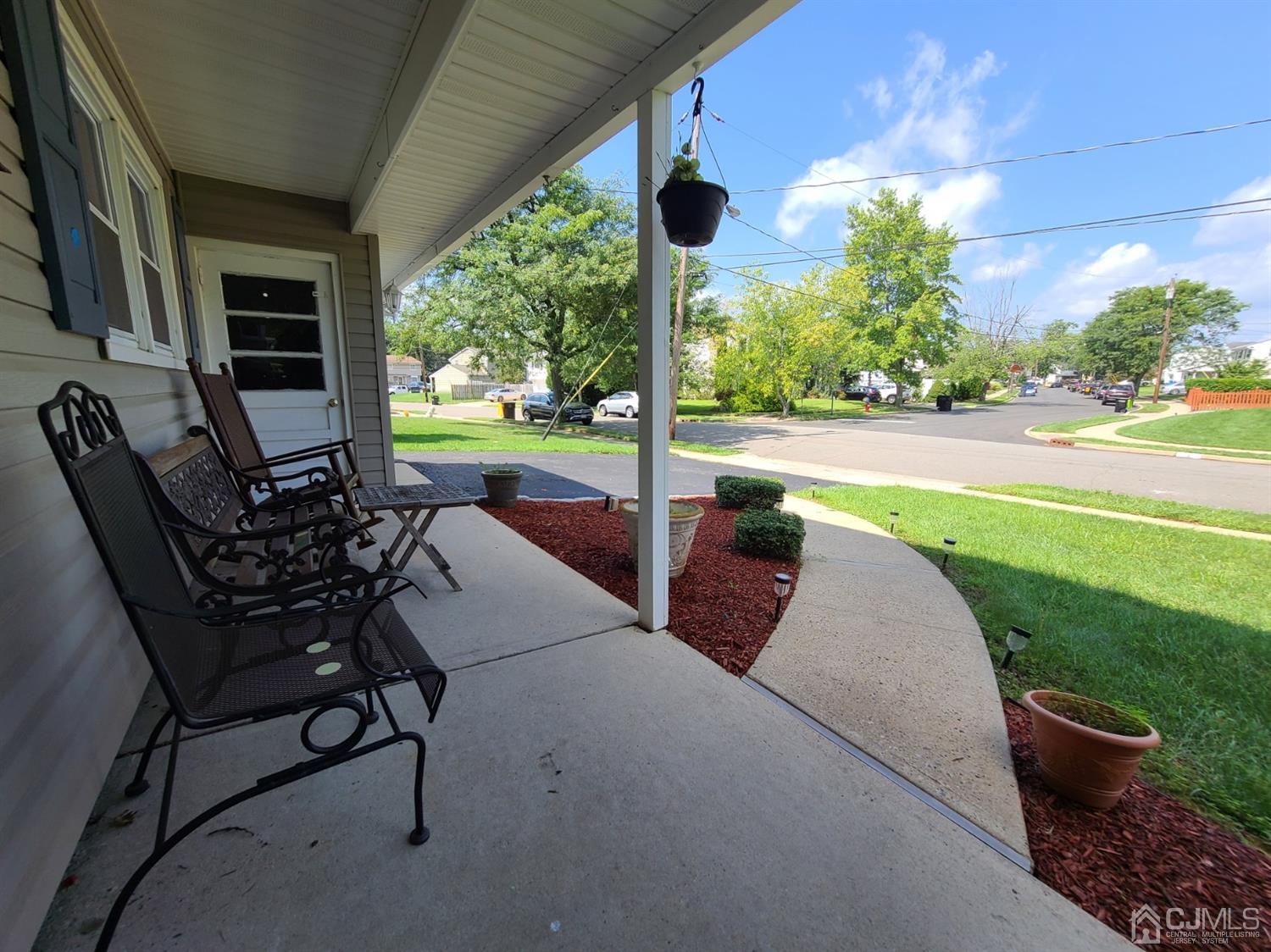 8 Chelsea Road Old Bridge, NJ 08857 - Photo 3 of 15 a view of a patio with table and chairs potted plants with outer view
