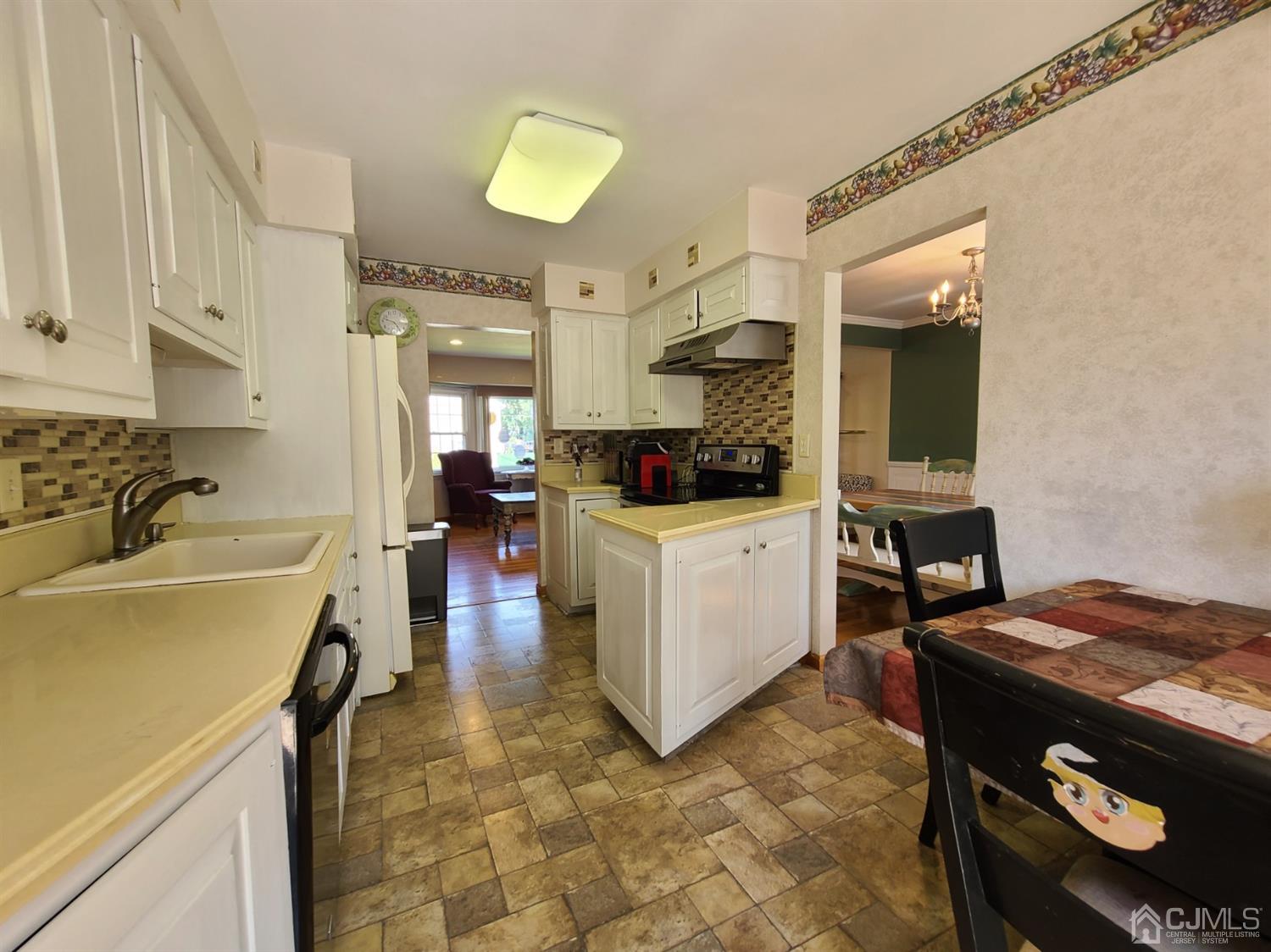 8 Chelsea Road Old Bridge, NJ 08857 - Photo 8 of 15 a kitchen with a sink appliances and cabinets