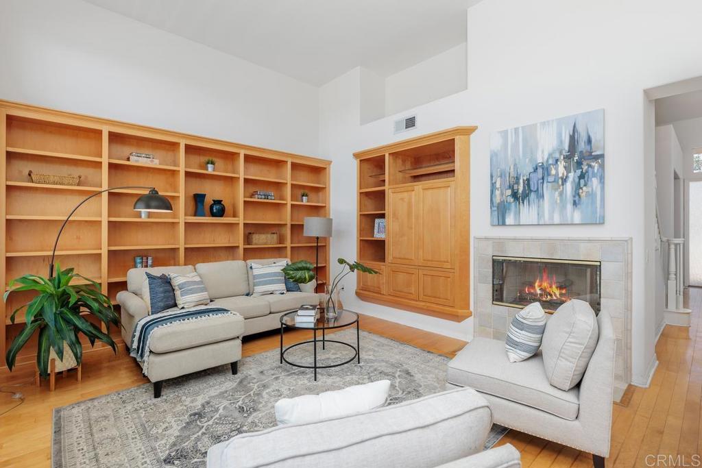 250 Pacific View Lane Encinitas, CA 92024 - Photo 13 of 40 a living room with furniture and a fireplace