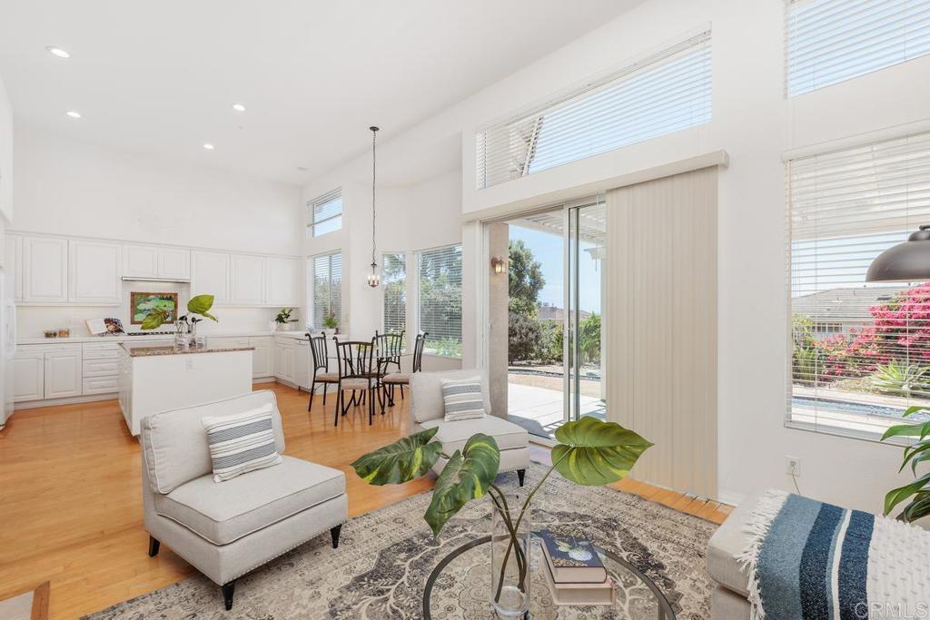 250 Pacific View Lane Encinitas, CA 92024 - Photo 14 of 40 a living room with furniture and a large window