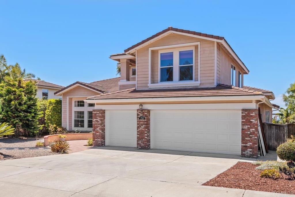 250 Pacific View Lane Encinitas, CA 92024 - Photo 3 of 40 a front view of a house with a yard