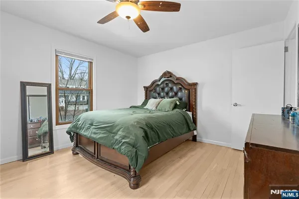 a bedroom with a bed and window