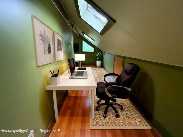 a view of workspace with wooden floor