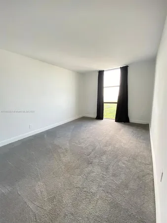 a bathroom with a sink mirror and shower