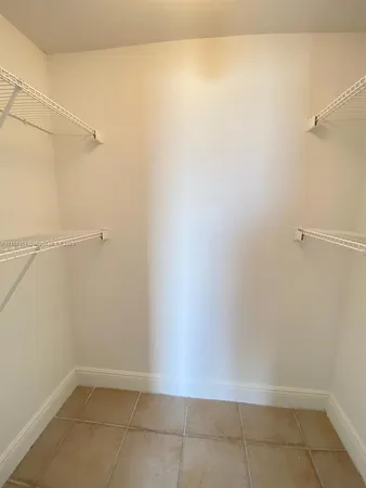 a large kitchen with a sink and cabinets