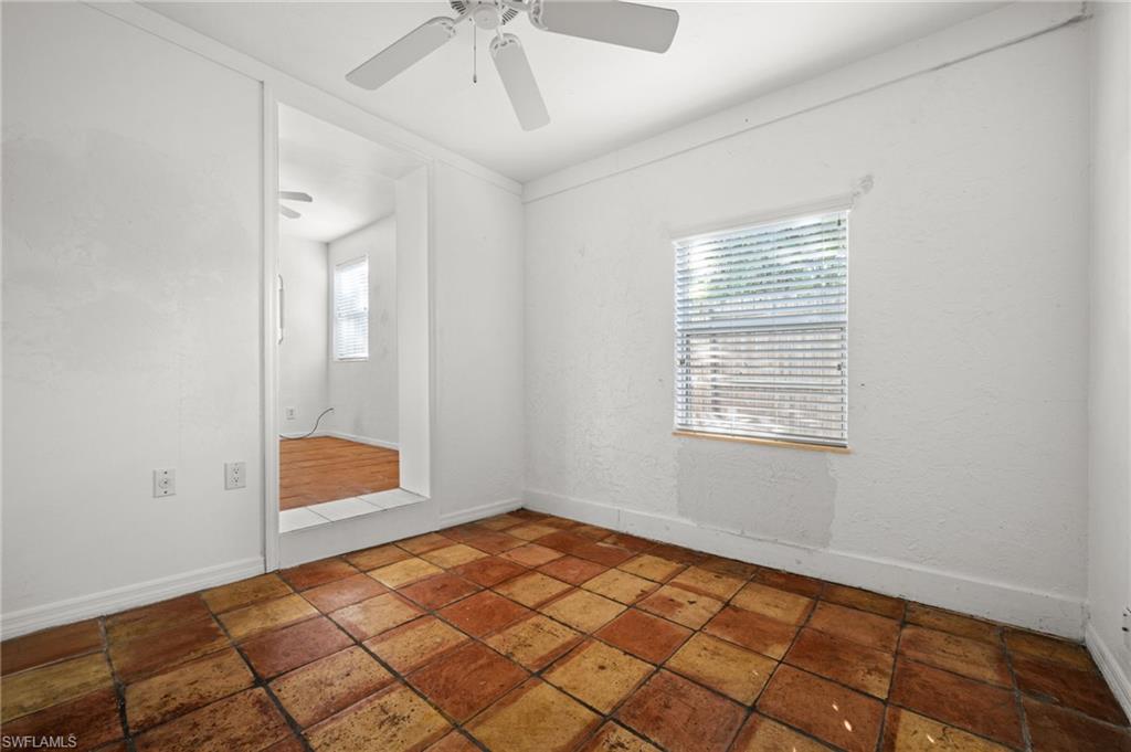 715 10th Street North Naples, FL 34102 - Photo 11 of 36 a view of an empty room and window