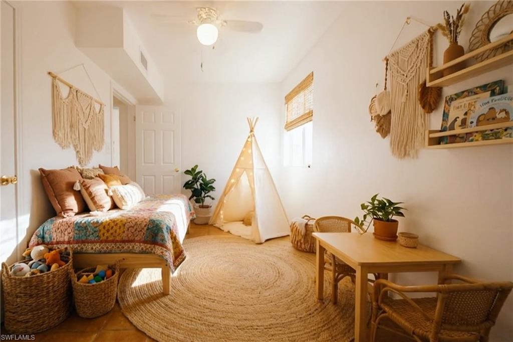 715 10th Street North Naples, FL 34102 - Photo 16 of 36 a living room with furniture and a wooden floor