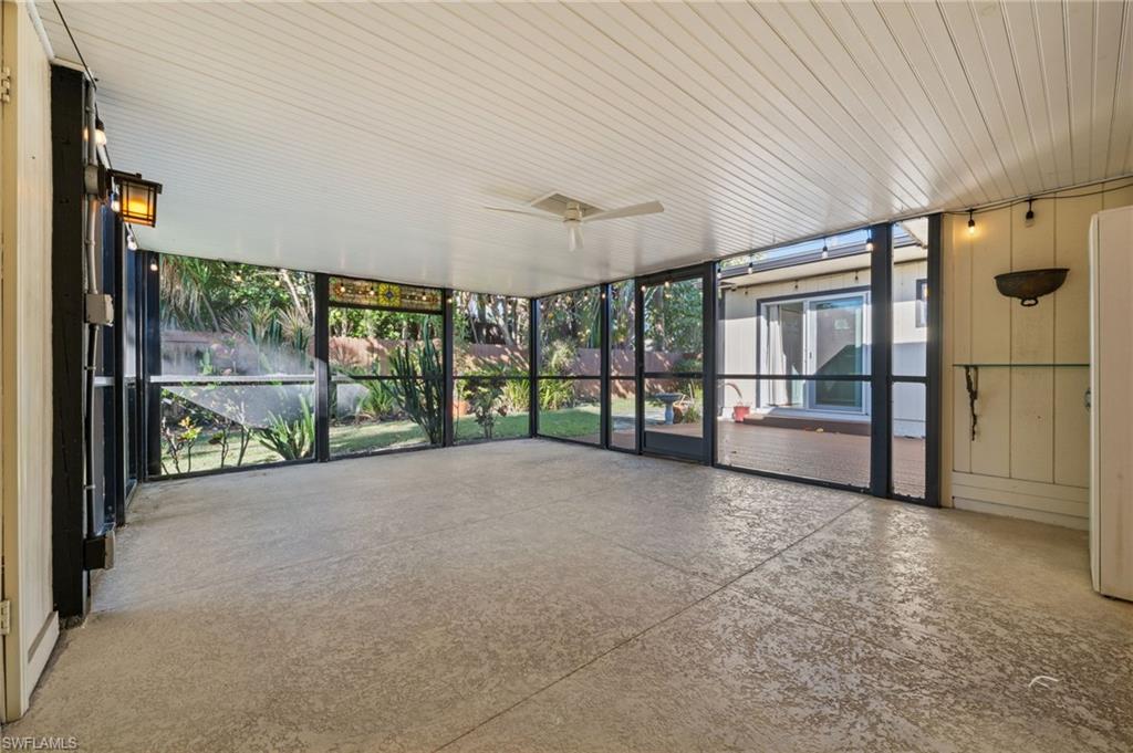 715 10th Street North Naples, FL 34102 - Photo 18 of 36 a view of an empty room with a balcony