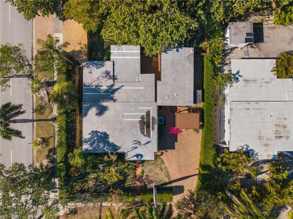 715 10th Street North Naples, FL 34102 - Photo 29 of 36 an aerial view of residential houses with outdoor space