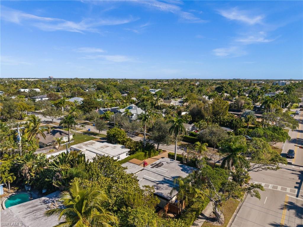 715 10th Street North Naples, FL 34102 - Photo 31 of 36 an aerial view of residential houses with outdoor space