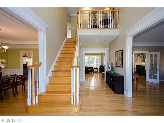 913 Rise Shaft Road Midlothian, VA 23114 - Photo 2 of 24 Foyer - The soaring, 2-story foyer sets the stage for this open and spacious floorplan. Detailed millwork, wide hallways and wood floors throughout the first floor are great.