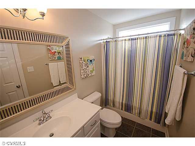 913 Rise Shaft Road Midlothian, VA 23114 - Photo 15 of 24 Guest Suite - Private bath for the guest suite has tile floors, tub/shower with transom window and stainless fixtures.