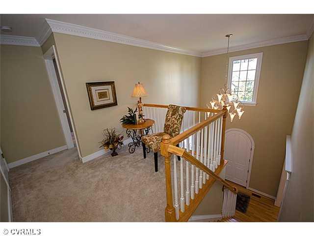 913 Rise Shaft Road Midlothian, VA 23114 - Photo 16 of 24 Loft - A cozy nook, perfect for a reading area. Notice the dentil trimwork throughout the upstairs and the gorgeous chandelier. 3 hall closets provide lots of storage space.