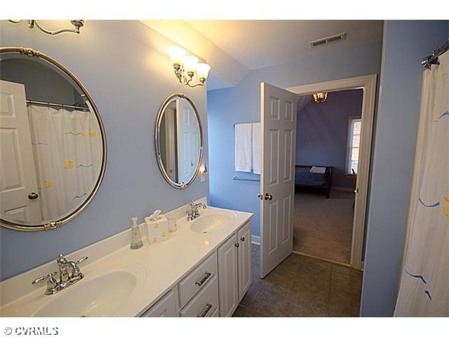 913 Rise Shaft Road Midlothian, VA 23114 - Photo 18 of 24 Bathroom - Tile floors and high-end drawer pulls make this jack/jill bath sparkle!