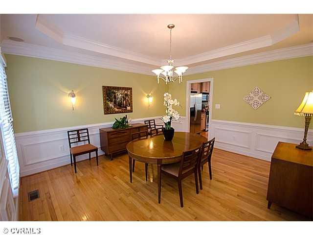913 Rise Shaft Road Midlothian, VA 23114 - Photo 9 of 24 Dining Room - Enjoy entertaining in this Dining Room that has a tray ceiling, exceptional trimwork, gorgeous chandelier and wall sconces and even built-in speakers for some dinner music!