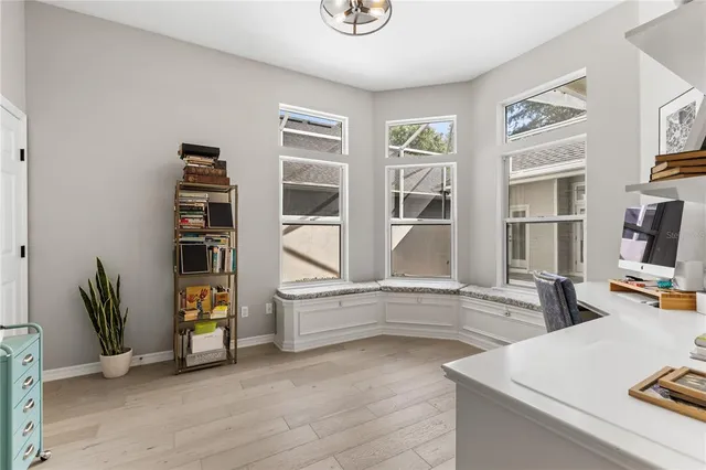 a view of living room with furniture and large window