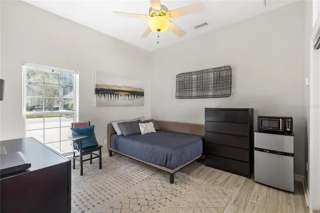 a bedroom with a bed and furniture