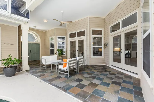 a lobby with furniture and a potted plant