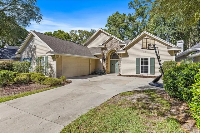 a view of a house with a yard and garage