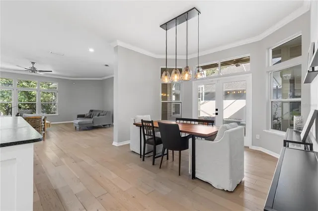 a room with lots of table and chairs