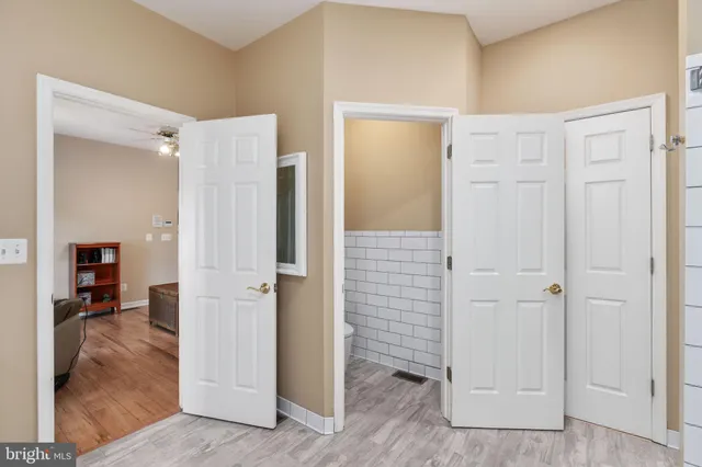 an aerial view of a house with a yard and large trees