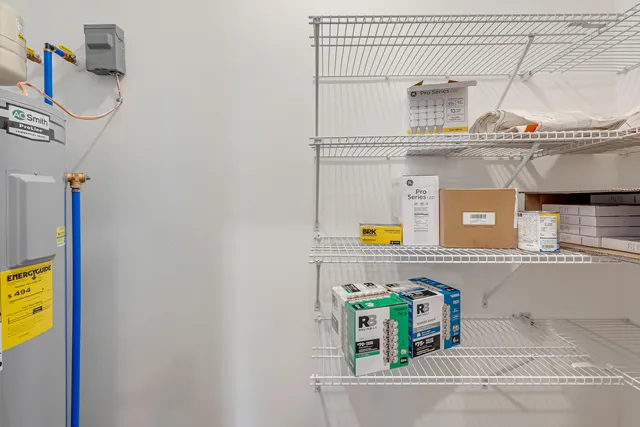 an empty room with wooden floor and window