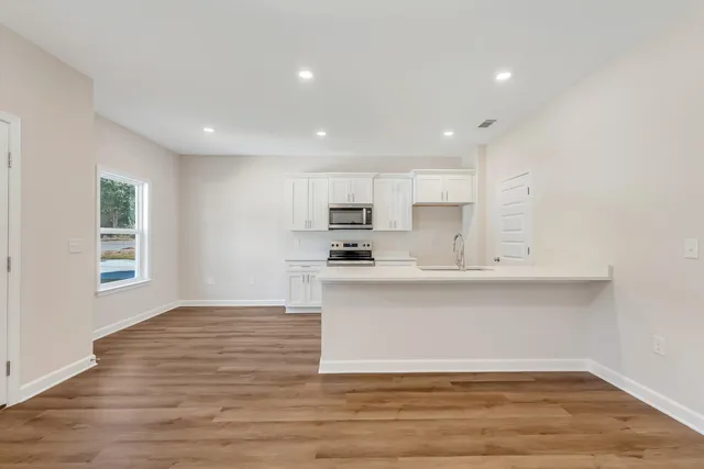 a view of kitchen with wooden floor