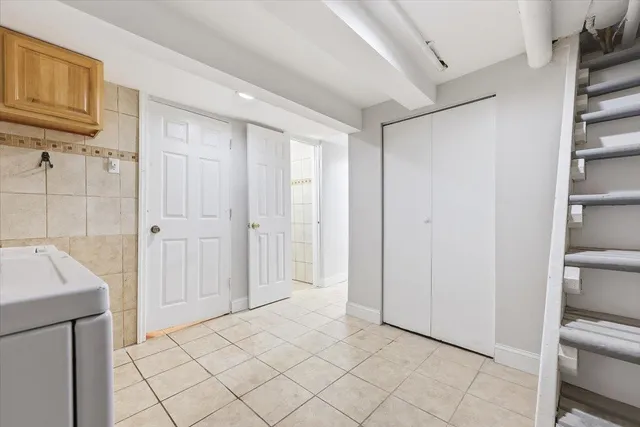 a view of a closet area with en suite bathroom