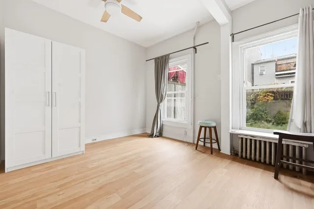 a view of livingroom with hardwood floor and a ceiling fan
