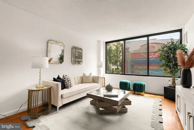 a living room with furniture and a large window