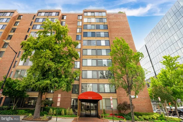 a kitchen with stainless steel appliances granite countertop a refrigerator and a stove