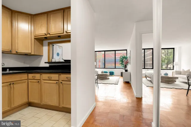 a kitchen with granite countertop cabinets stainless steel appliances a sink and cabinets