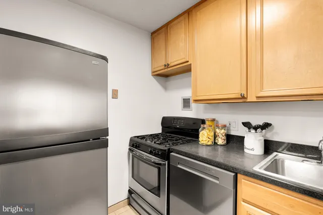 a kitchen with a sink and a window