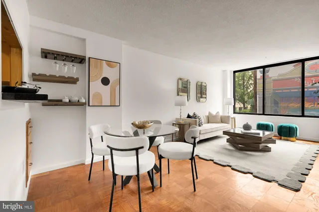 a view of a dining room with furniture and wooden floor