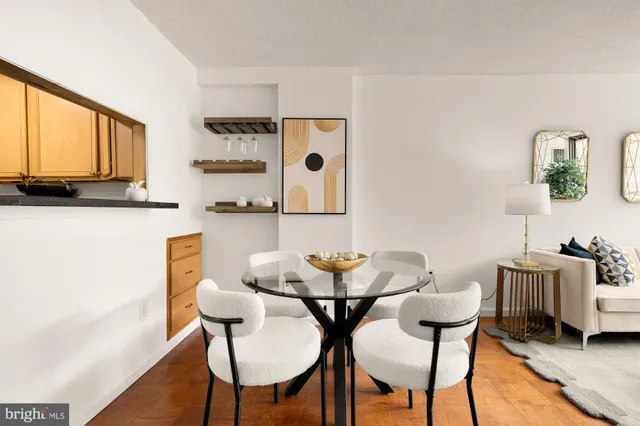 a dining room with furniture and window